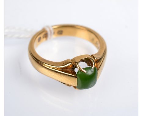 A late Victorian or Edwardian 18ct. gold gentlemans ring set with jade, 9.7g. inscriptions to the edge and inside. Condition 