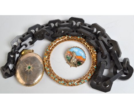 A vulcanite, late Victorian necklace, a gilt locket, a gilt bangle and an enamelled brooch.