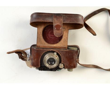 A Leica III camera serial number 146667, circa 1934 with F5 1.3,5 Elmar lens, leather ever ready case.