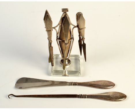 A six piece silver mounted manicure set by Sanders and Mackenzie, Birmingham, 1939, together with a button hook and shoe horn