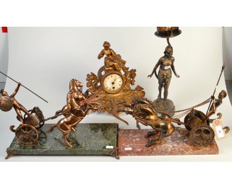 Two cast brass chariots, an Art Nouveau sculptural table lamp and a sculptural mantel clock.