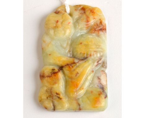 THE LESLIE DAVIE COLLECTION OF JADE

A cream and a russet veined jade pendant probably late 19th century carved with a fisher