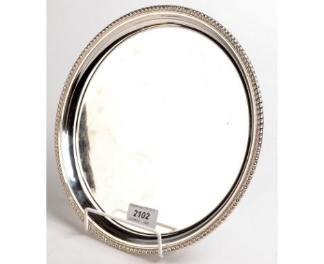 A Canadian circular silver card tray with beaded border by Birks Sterling, 485gms, 25.7cm.
