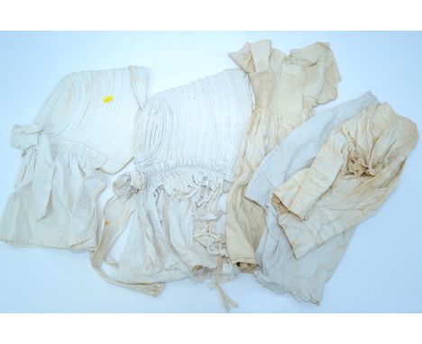 Two Victorian white bonnets, together with a quantity of children's clothing.
Note: The bonnets were worn by the vendor's gre