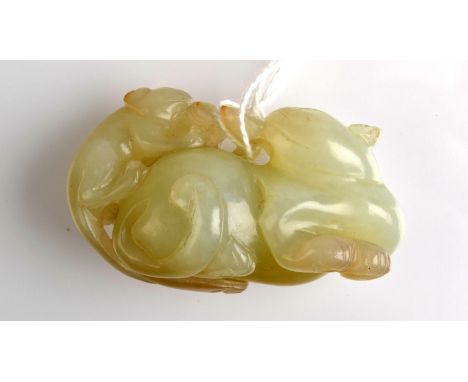 THE LESLIE DAVIE COLLECTION OF JADE

A white jade carving probably 19th century of a recumbent cat and a kitten, length 5.5cm