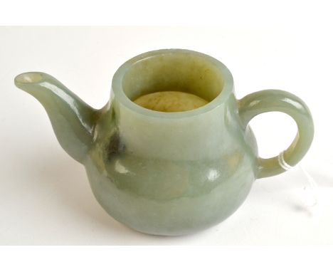 THE LESLIE DAVIE COLLECTION OF JADE

A green jade teapot, lacks cover, signed to the bottom with a four character zhuanshu sc