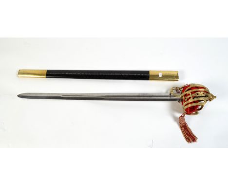 THE BRIAN WHIPP COLLECTION

An officer's Scottish (Claymore) ceremonial broad sword with a brass basket hilt in a leather sca