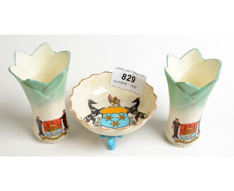 A pair of Goss Truro souvenir leek crested vases and a Lizard souvenir bowl on three coral feet.
