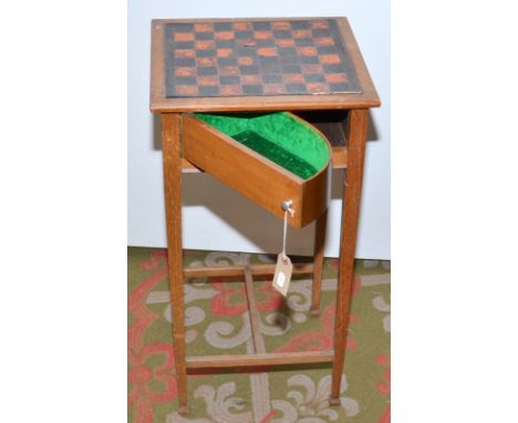 A light oak patent chess table with pivoting velvet lined compartments, the top with inset tooled leather chess board, 38 x 3