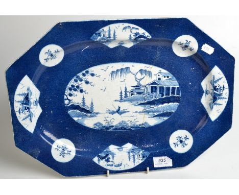 An 18th powder blue Bow dish of elongated octagonal form, fan and circular reserves to the border and an oval circular reserv