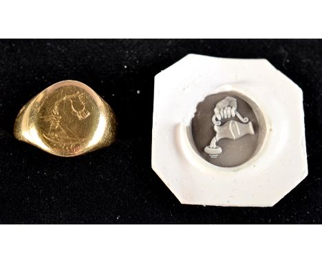 A signet ring engraved with a pouring jug. Condition Report: Unmarked or maybe marks rubbed away. Weight is 6.8g
