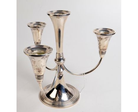 An American silver four light candelabrum, with conical sconces and circular spreading base, stamped 'International Sterling,