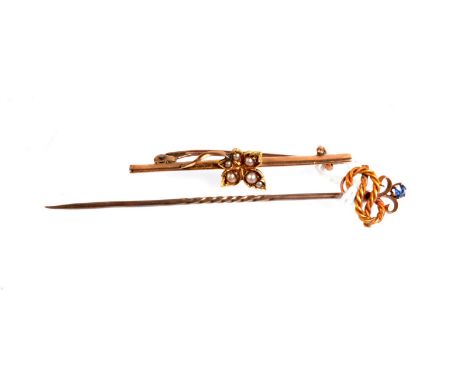 A dogs stick pin, a knop finial set of loose stones, together with a gold, pearl set maple leaf bar brooch.