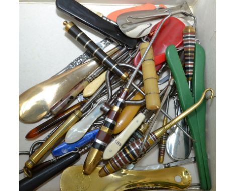 A collection of around 40 button hooks and shoe horns including advertising etc.