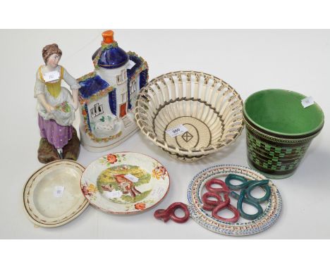 A creamware basket, circa 1780. Together with a Staffordshire figure, a Staffordshire cottage and a Prattware pipe, damage, e