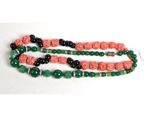 A stylish Art Deco glass necklace simulating jade and diamonds together with one other stylish necklace. Condition Report: A 