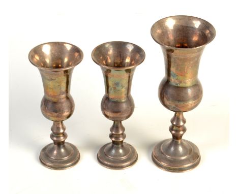 A pair of silver Kiddush wine cups by Joseph Zweig (J. Zeving), Chester, 1919, height 10cm, together with a similar Kiddush c