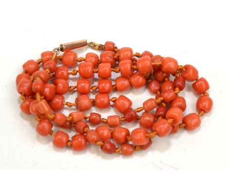 A coral bead necklace with gold clasp. Condition Report: Weight 11.6 gm.