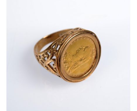 A Victorian shield back half sovereign 1890, in 9ct. gold ring mount, 9.4g.