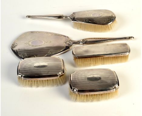 A Canadian silver backed four piece dressing table set, each stamped 'Birks Sterling', together with a dissimilar silver back