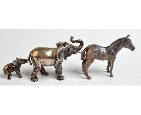A Post-War silver, naturalistic ,miniature model of an elephant, London, 1976, together with a larger, continental model of a