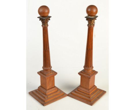 A pair of light oak, ball finial, classical column obelisks, height 43.5cm.
