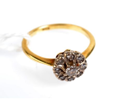 An 18ct. gold diamond cluster ring. 