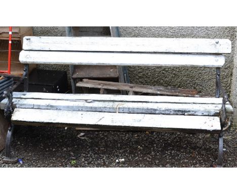 A slatted wood garden bench with dragon cast ends, width 157.5cm.