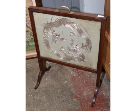 A fire screen with oriental needlework panel.