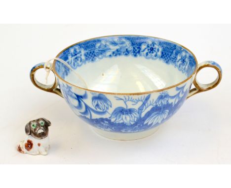 Blue and white pearlware two handled bowl decorated with Oriental print, together with Japanese pepper pot as a Pekingese dog