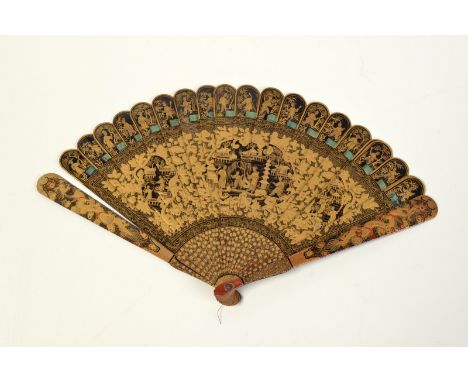 An early 19th century Chinese black lacquered fan finely painted with gold and red. Condition Report: One stick is split.  Th