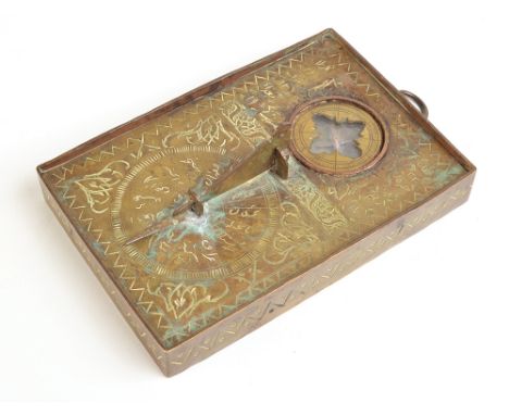 An early 20th century Indo-Persian Qibla Indicator, with a low folding gnomon and steel cruciform compass. (See illustration)