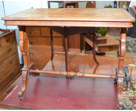 A good, Victorian, rectangular, walnut veneered centre table, with carved twin pedestals, and scale carved single stretcher, 