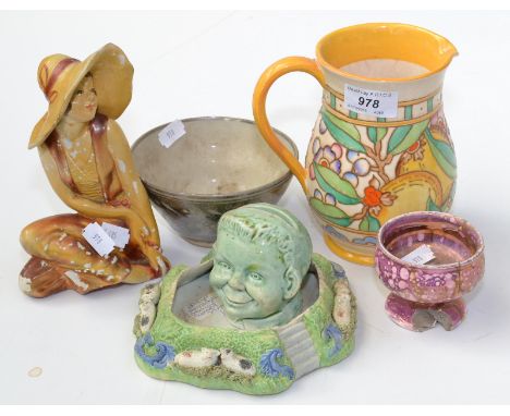 A Bursley ware jug by Charlotte Rhead. Together with a pottery bowl, a green-glaze money box and three other items. 