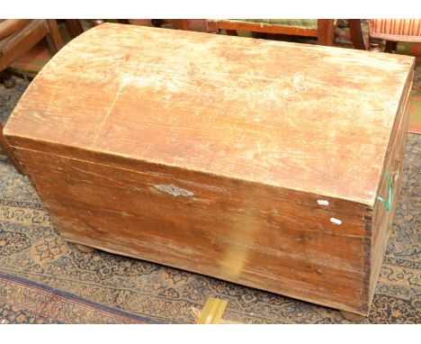 A George III light oak boarded chest on exaggerated bracket feet, width 142cm, height 55cm.