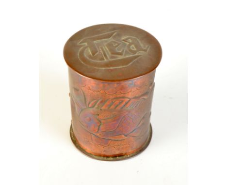 A Newlyn copper cylindrical tea caddy decorated with two fish the lid inscribed  "Tea", height 10cm. 