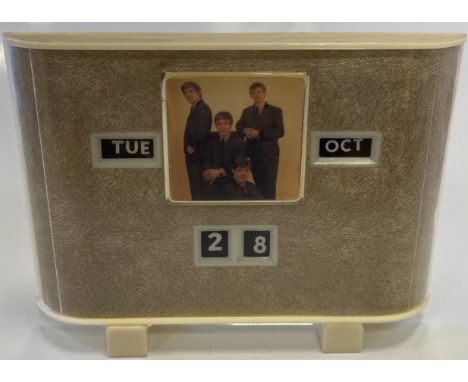 BEATLES CALENDAR CLOCK. An original circa 1960s Beatles calendar clock, noted in Crawford/Stern/Lamon's 'Beatles Reference &a