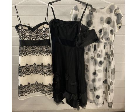 3 occasion wear dresses in monochrome shades. A black satin detachable spaghetti strap dress with black net overlay and net f