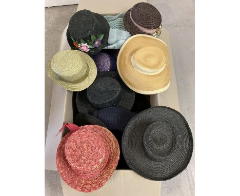 A large box of assorted vintage summer hats, straw style hats and boaters. In varying colours, styles and conditions. 