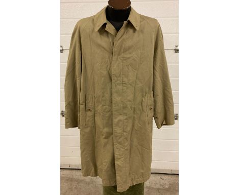 A men's vintage Burberry khaki coloured rain mac. 