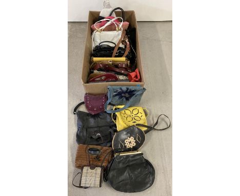 A large collection of assorted vintage and modern handbags. In varying styles, colours and conditions, to include leather and