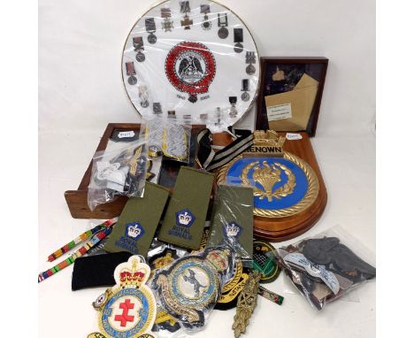 A composition ship's crest, HMS Renown, various cloth badges, epaulettes, insignia and other items  Provenance: On Instructio