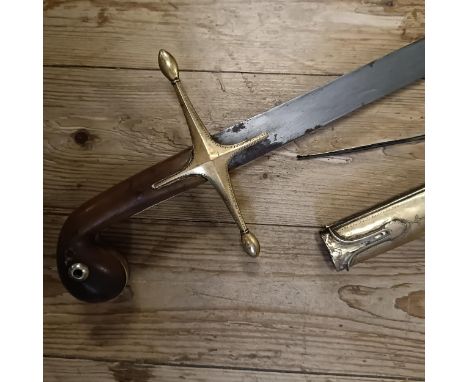 A 19th century Shamshir sword, with a horn handle, in a leather scabbard, the metal mounts with engraved decorationBlade unma
