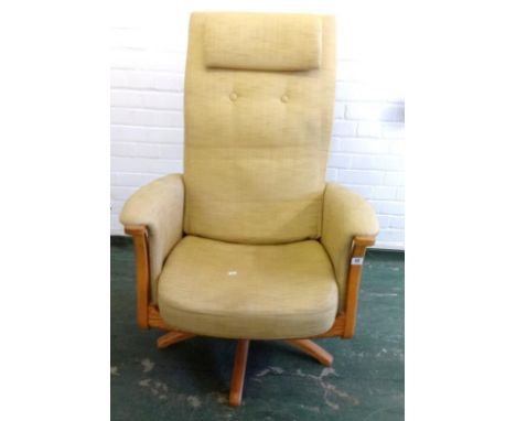 Ercol High Ladder Back Swivel Armchair on 4 raised sectioned supports 