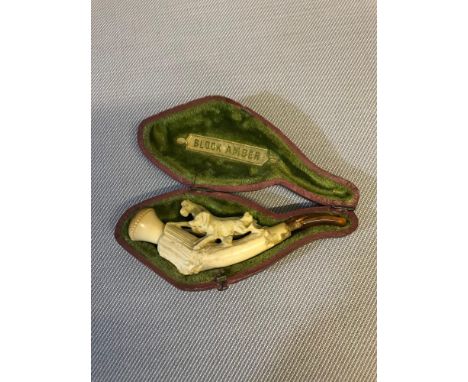 Cased Meerschaum pipe. Depicting dog and horse. Damage to amber mouth piece 