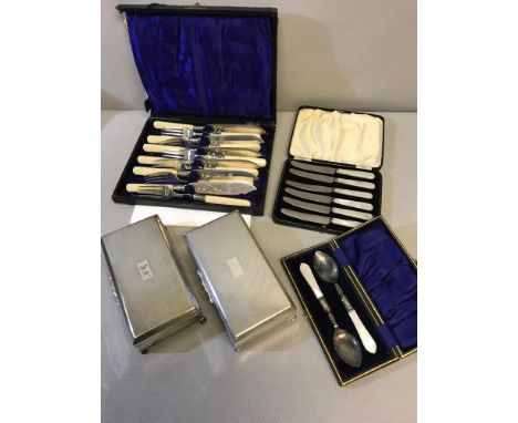 2 EP Four foot cigarette boxes together with 2 Mother of pearl handled cutlery sets & ornate knife and fork set. 