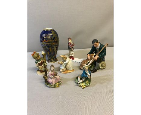 A Collection of mixed porcelain which includes Royal Doulton "The Master" figure, Peter rabbit Beswick figure, 2 Antique Napl