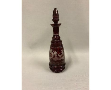 A Bohemian ruby etched glass decanter depicting a stag design 