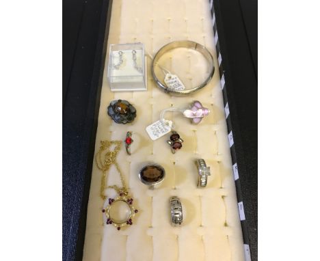 A Collection of silver jewellery which includes 6 rings, Scottish agate and silver brooch, Silver bangle and silver gilt pend