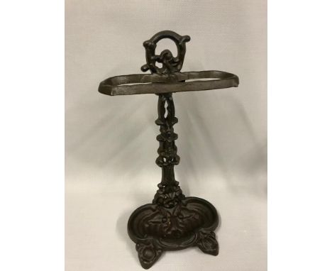 Cast metal ornate stick stand. Measures 50x25x18cm 